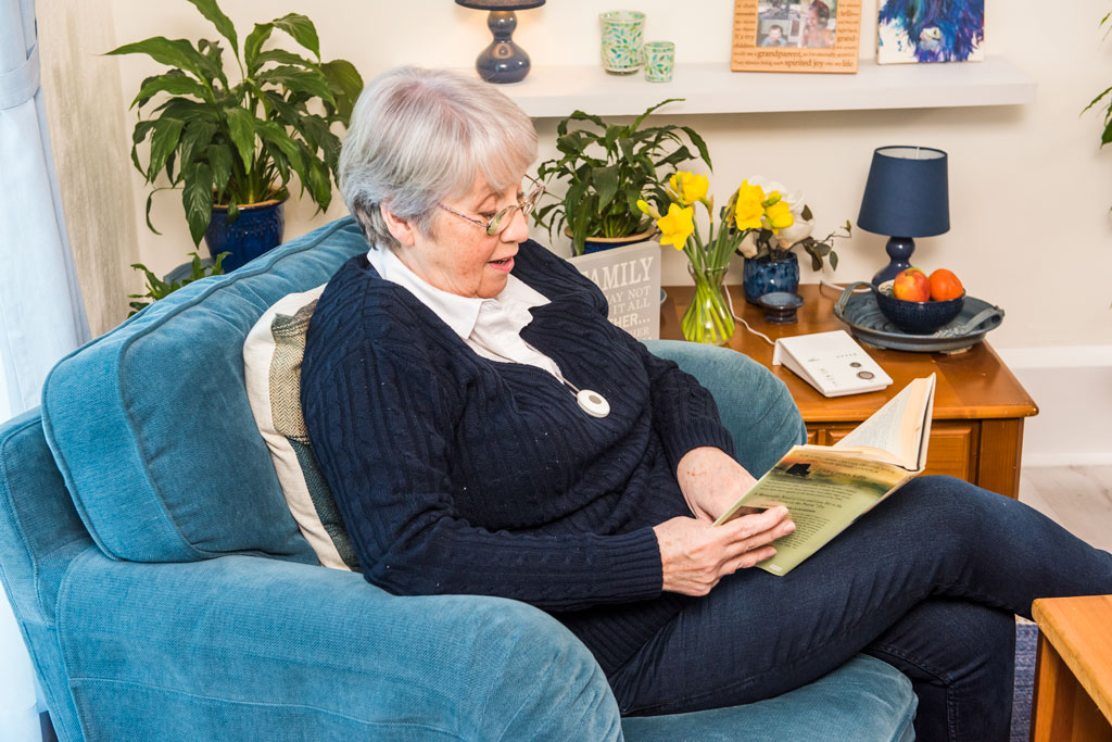 Lady sat down reading a book