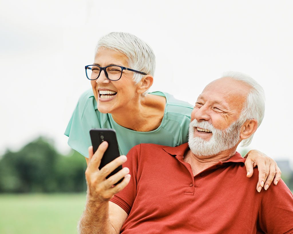 Senior couple with mobile phone